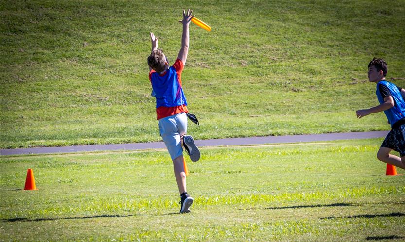 Students play ultimate frisbee
